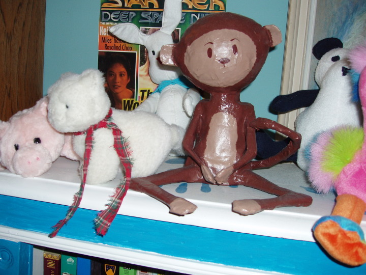 paper mache monkey plus stuffed animals